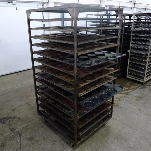 200 - 1 metal wheeled bakers rack containing a quantity of metal trays