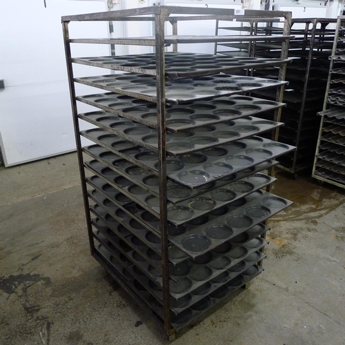 201 - 1 metal wheeled bakers rack containing a quantity of metal trays