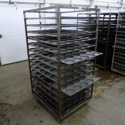 202 - 1 metal wheeled bakers rack containing a quantity of metal trays