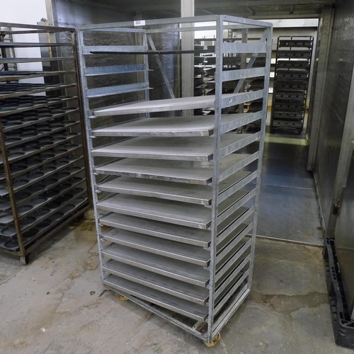 203 - 1 metal wheeled bakers rack containing a quantity of metal trays