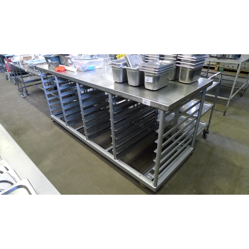 251 - 1 stainless steel wheeled table with shelf racks beneath (no shelves included) approx 213cm x 76cm x... 