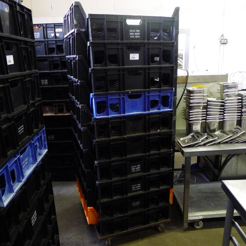 298 - 60 stacking plastic bread trays and 3 wheeled skates (mainly black coloured)