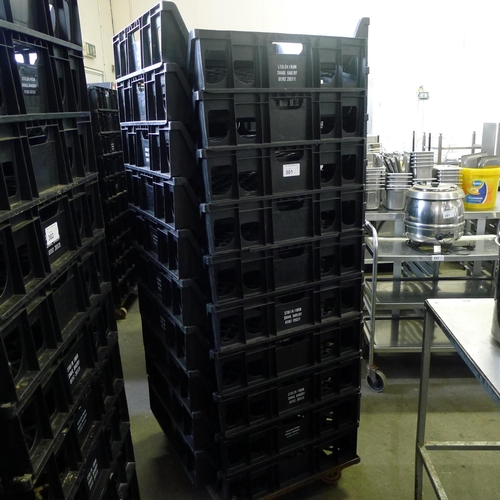 301 - 60 stacking plastic bread trays and 3 wheeled skates (mainly black coloured)