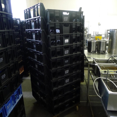 303 - 60 stacking plastic bread trays and 3 wheeled skates (mainly black coloured)