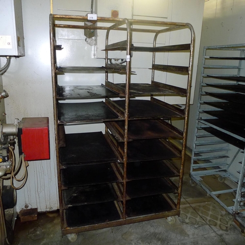 318 - 1 metal wheeled bakers rack containing a quantity of metal trays