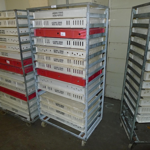 321 - 1 metal wheeled rack containing a quantity of plastic trays