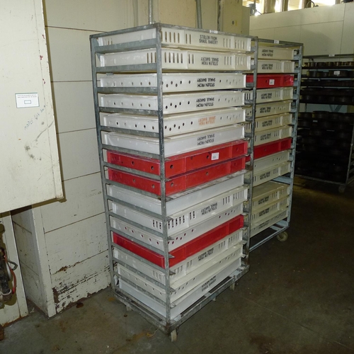 322 - 1 metal wheeled rack containing a quantity of plastic trays