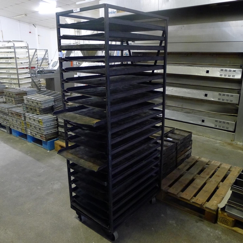 410 - 1 wheeled metal bakers rack containing a quantity of metal trays