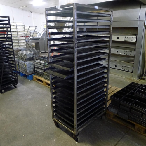 411 - 1 wheeled metal bakers rack containing a quantity of metal trays