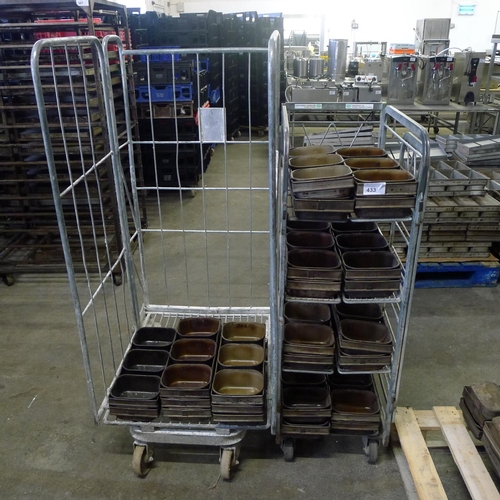 433 - 2 wheeled metal cages containing a total of 24 sets of 3 bread tins (for 400g loaves) - The two meta... 