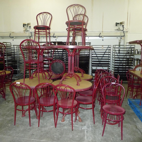 57 - 22 red metal cafe chairs and 7 matching round tables with heavy cast metal bases diameter of each ap... 