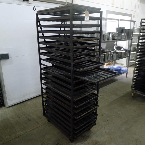 85 - 1 metal wheeled bakers rack containing a quantity of metal trays