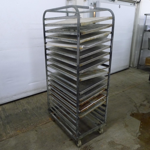 88 - 1 metal wheeled bakers rack containing a quantity of metal trays