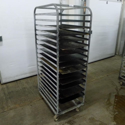 89 - 1 metal wheeled bakers rack containing a quantity of metal trays