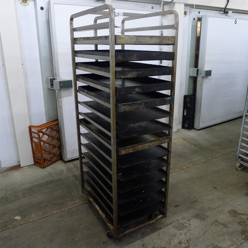 90 - 1 metal wheeled bakers rack containing a quantity of metal trays