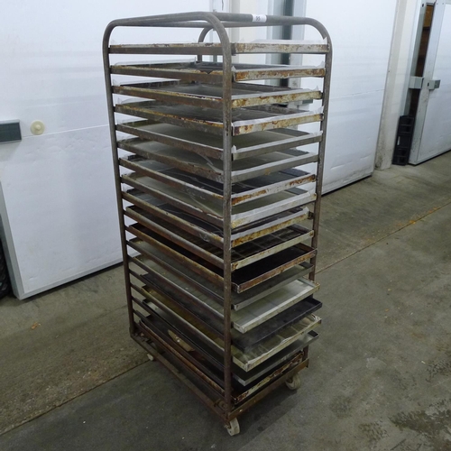 95 - 1 metal wheeled bakers rack containing a quantity of metal trays