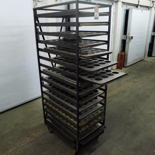 96 - 1 metal wheeled bakers rack containing a quantity of metal trays