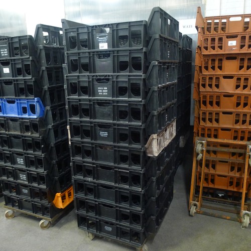 297 - 60 stacking plastic bread trays and 3 wheeled skates (mainly black coloured)