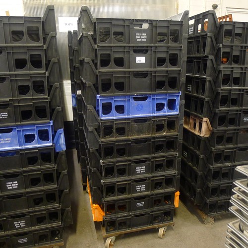 298 - 60 stacking plastic bread trays and 3 wheeled skates (mainly black coloured)