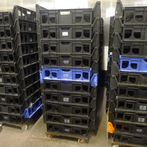 299 - 60 stacking plastic bread trays and 3 wheeled skates (mainly black coloured)