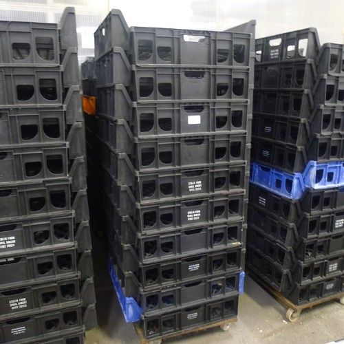 300 - 60 stacking plastic bread trays and 3 wheeled skates (mainly black coloured)