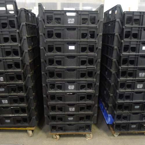 301 - 60 stacking plastic bread trays and 3 wheeled skates (mainly black coloured)