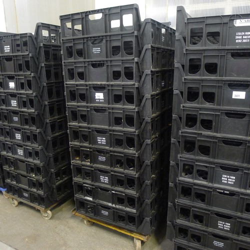 302 - 60 stacking plastic bread trays and 3 wheeled skates (mainly black coloured)