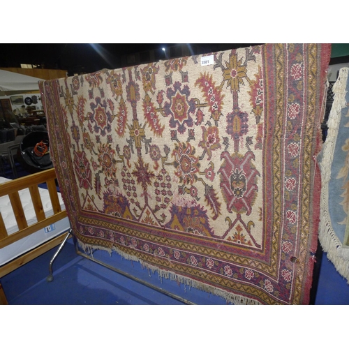 3581 - A multi-coloured oriental rug (a little threadbare in places and has a small hole)