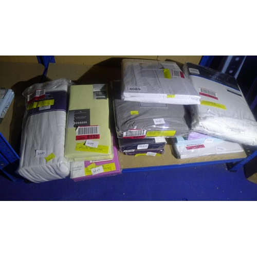 4089 - A quantity of various bedding in various sizes, contents of one shelf