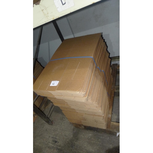 102 - A quantity of flat packed cardboard boxes, please see pictures for more details  31cm x 24cm x16cm