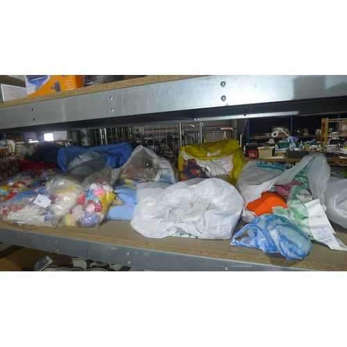 126 - A large quantity of various wool and knitting needles etc. Contents of one wide shelf