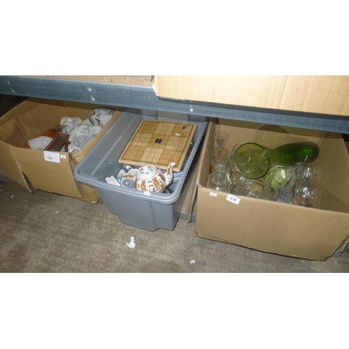 128 - A quantity of various items including glasses, crockery etc. Contents of one shelf