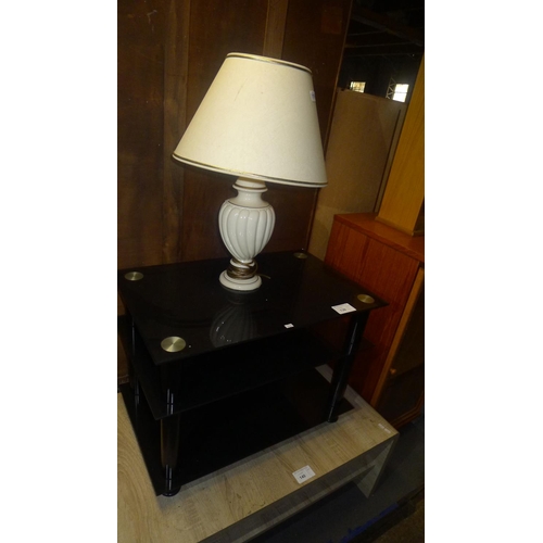 139 - 1 black glass TV stand and 1 table lamp with shade (Trade)