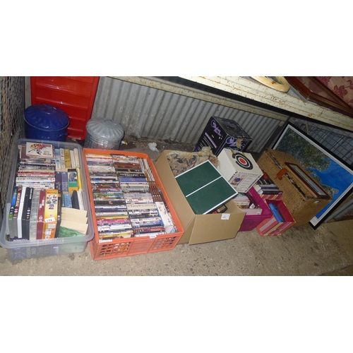 175 - A quantity of various items including a fondue le creuset set, many DVDs, books, bins, wicker basket... 