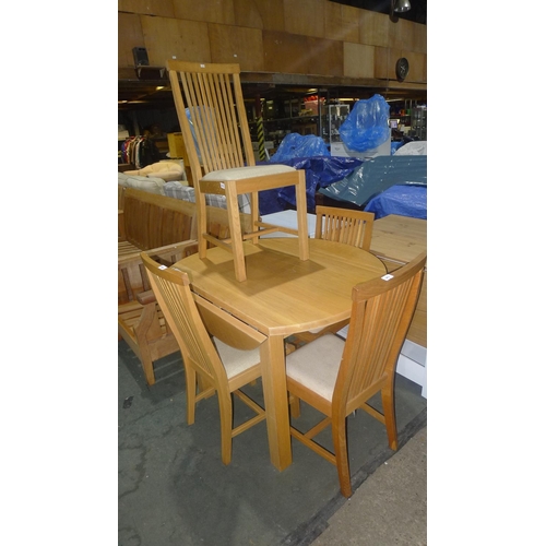 183 - A solid wood round drop leaf table set (approx 107cm) with 4 cream upholstered dining chairs