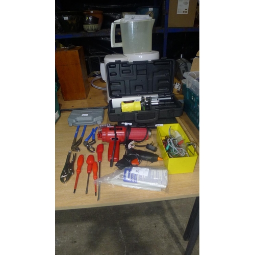 60 - A quantity of various tools including a laser level, hot air gun, glue gun etc