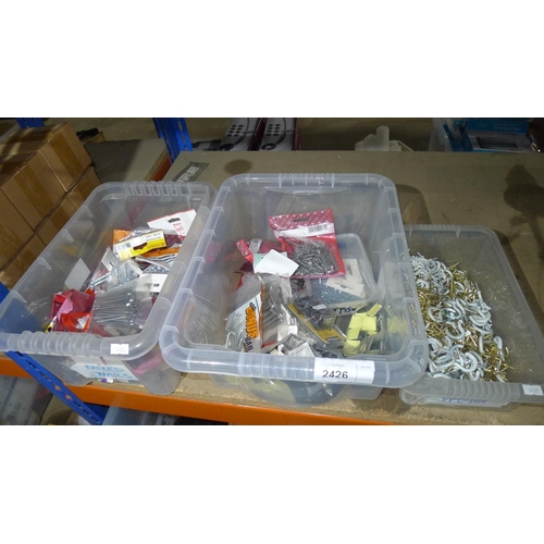 2426 - 3 boxes containing a quantity of various screw in hooks, staples, ring nails, oval nails, tacks etc