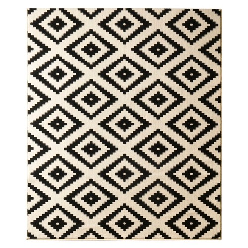 4474 - A black and cream patterned rug approx 200x290cm