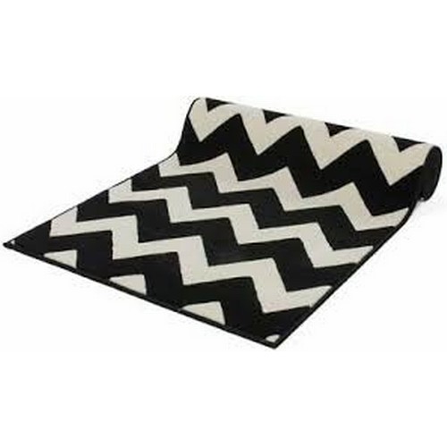 4475 - A black and cream patterned rug by Kayoom approx 200x290cm