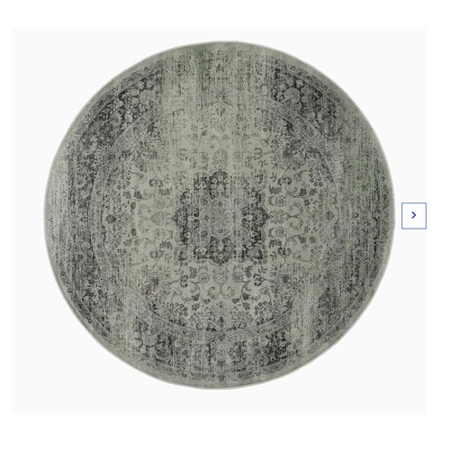 4537 - A large green patterned rug approx 6ft round approx £120