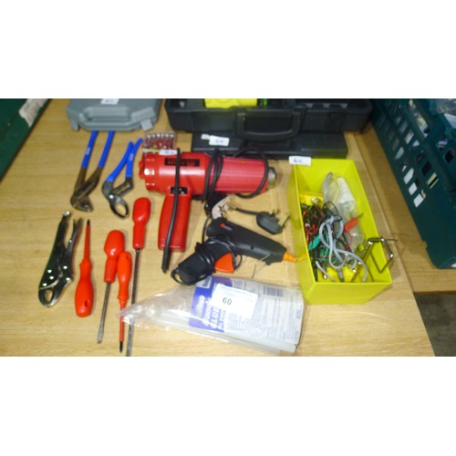 60 - A quantity of various tools including a laser level, hot air gun, glue gun etc