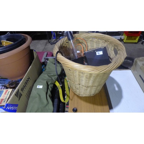 91 - A quantity of various items including a dart board, wicker basket, books etc