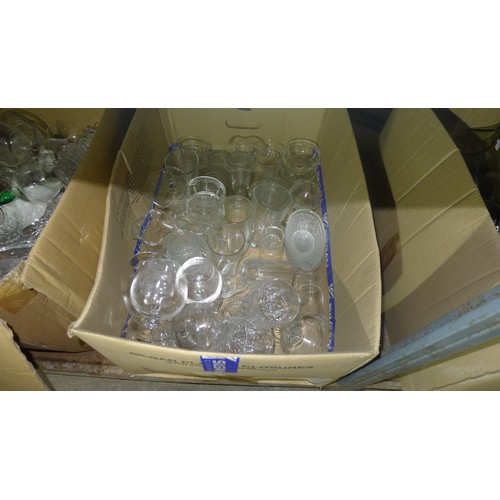 129 - A large quantity of various items including crockery, glasses, table lamps etc trade lot, contents o... 