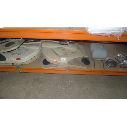 5264 - A quantity of various vehicle parts including a vintage grille, Jaguar door cards, 2 lights etc. Con... 