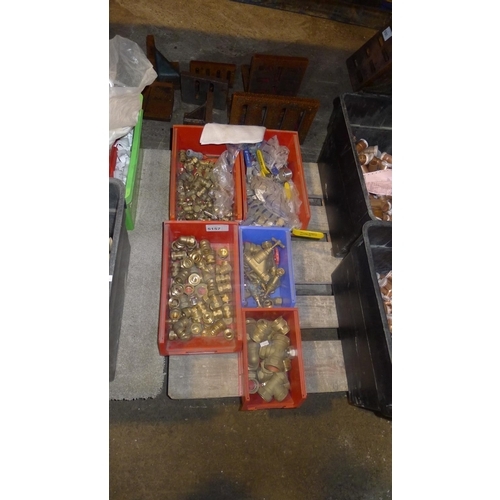 5157 - 5 plastic boxes containing a quantity of various plumbing fittings, valves etc - mainly brass but se... 