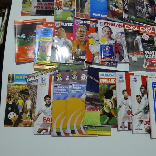 8129 - 1 pallet containing a large quantity of various football programmes including England Internationals... 