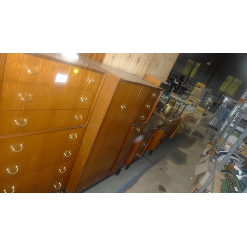 2112 - A three piece G-Plan bedroom suite comprising of a chest of 7 drawers, a dressing table with mirror ... 