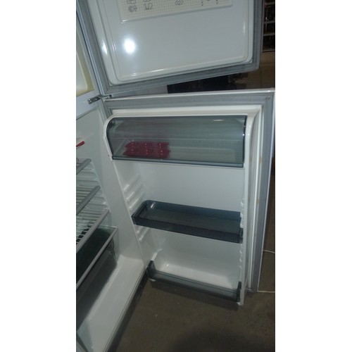 1114 - A 3/4 height fridge freezer by Zanussi - requires attention 240v trade