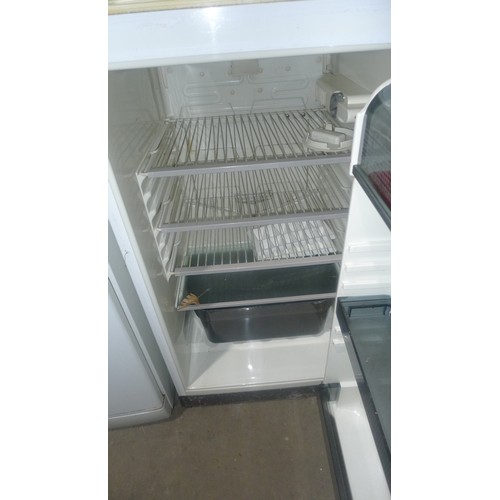 1114 - A 3/4 height fridge freezer by Zanussi - requires attention 240v trade