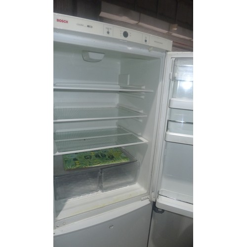 1115 - A tall fridge freezer by Bosch missing one handle - requires attention 240v trade